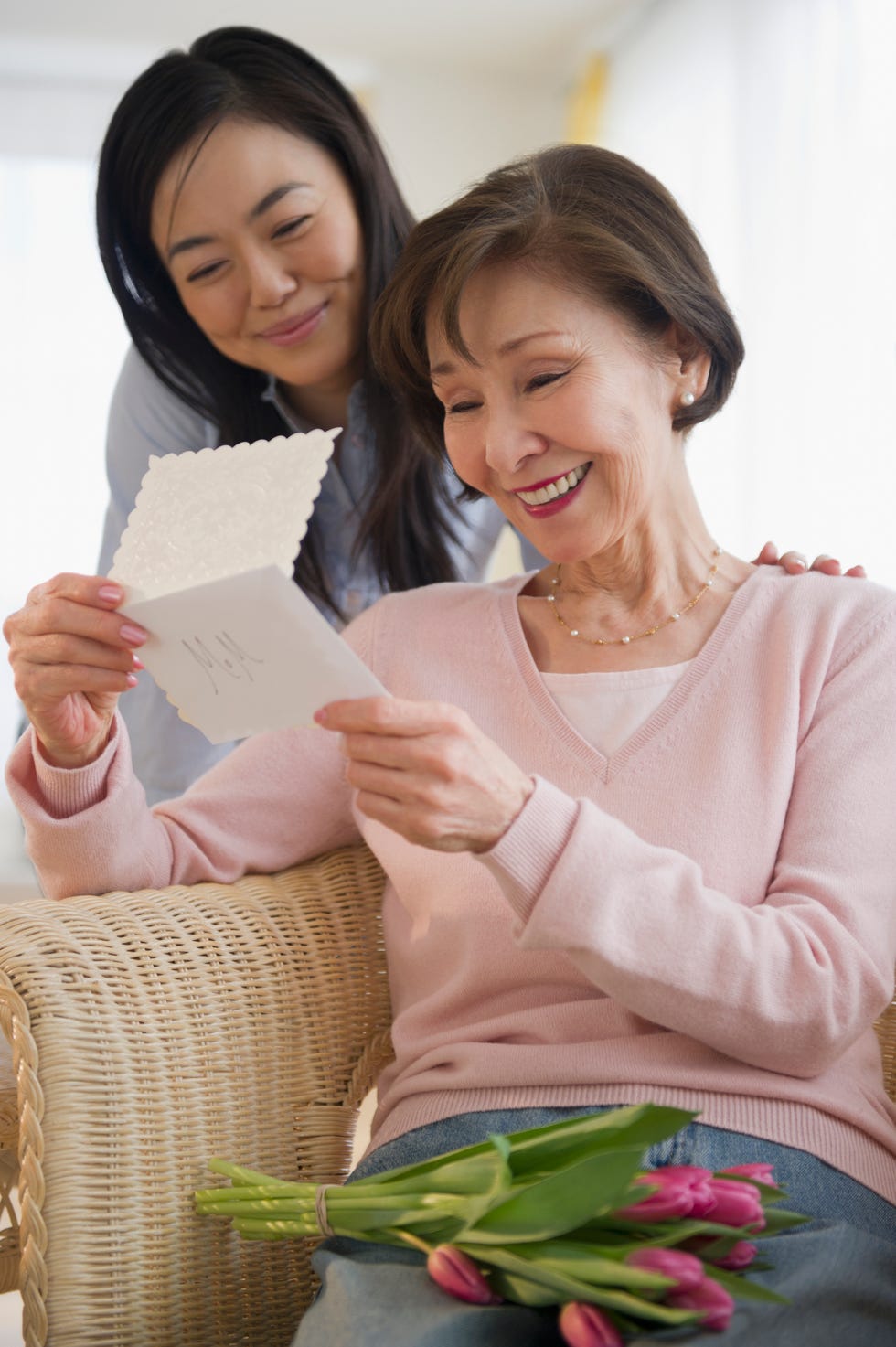 Japanese mother reading card from daughter