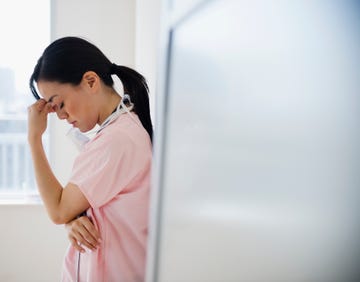 japanese nurse with a headache