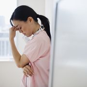 japanese nurse with a headache