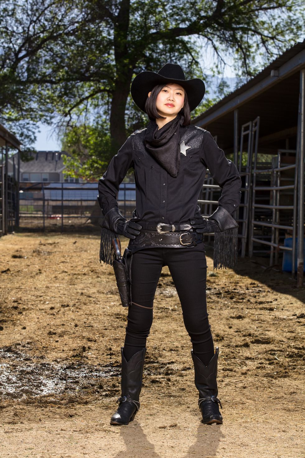 japanese woman in allblack cowgirl costume