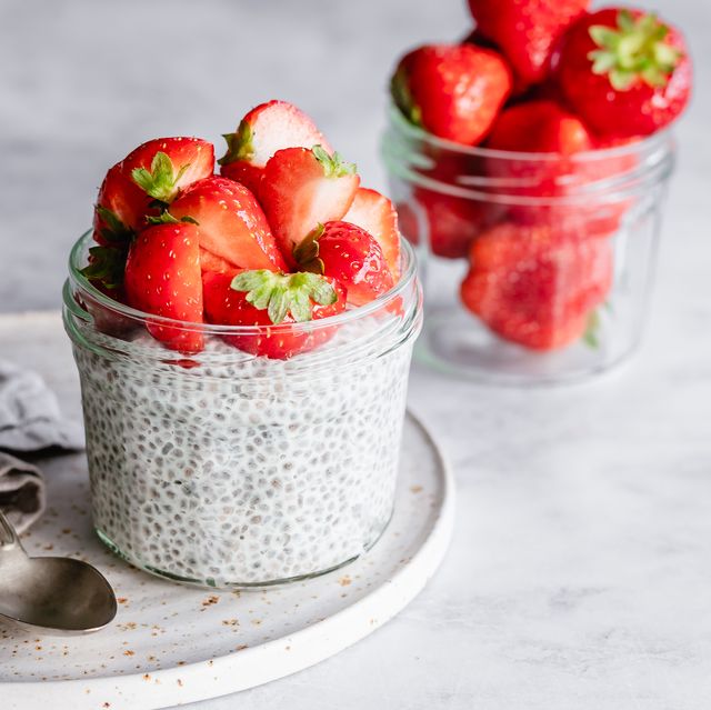 jar of chia pudding topped with fresh strawberries