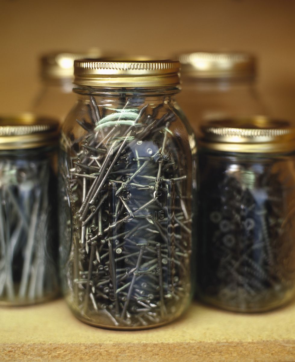 jars of nails and screws on a shelf