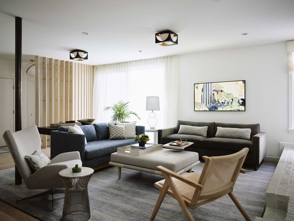 living room, family room, dark gray and blue sofa, gray ottoman coffee table