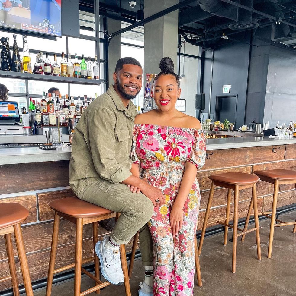 easter outfit ideas influencer jasmine katrina wearing a floral jumpsuit alongside her husband on good friday