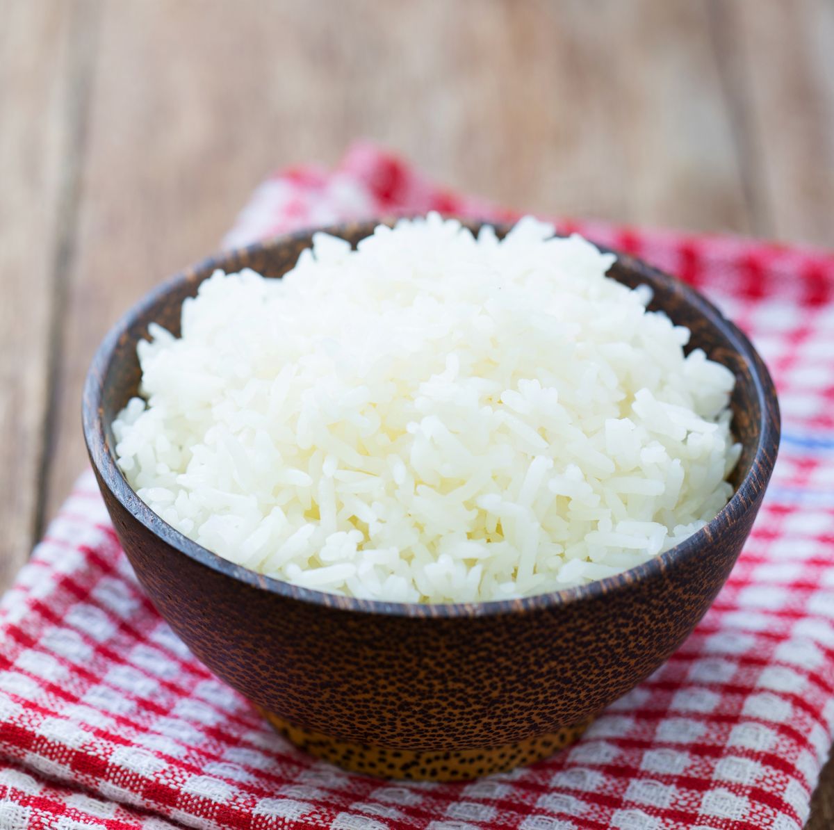 jasmine rice in a  bowl on wood table