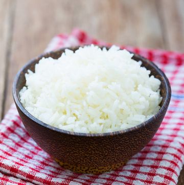 Jasmine rice in a  bowl on wood table