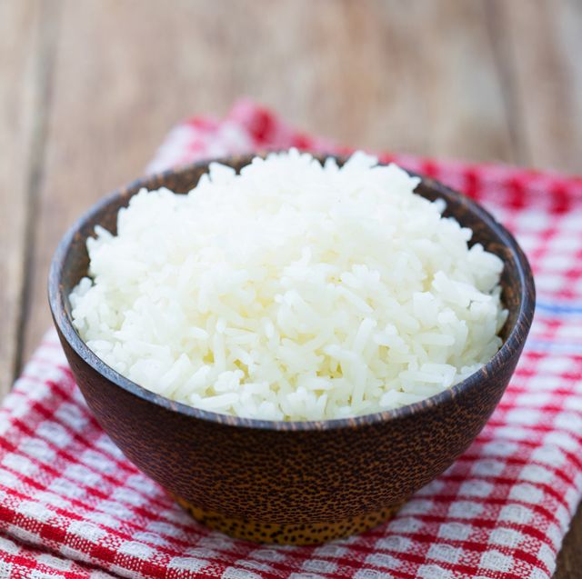 Jasmine rice in a  bowl on wood table