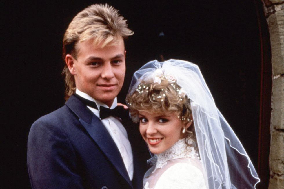 jason donovan as scott, kylie minogue as charlene on their wedding day in neighbours 1988