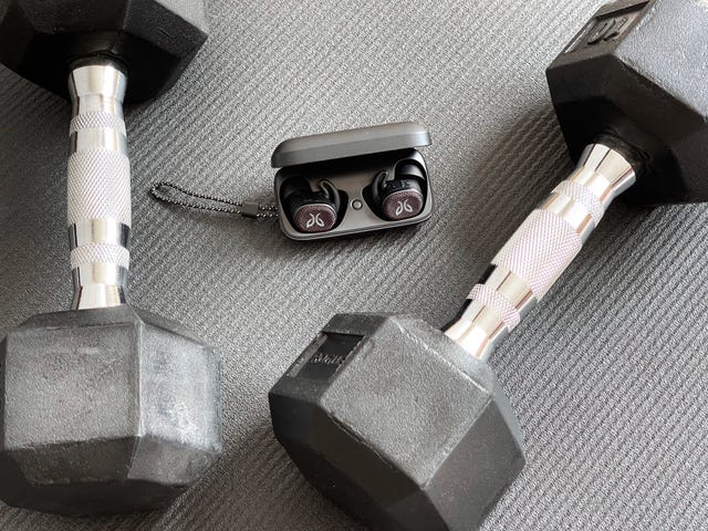 jaybird vista 2 earbuds on yoga mag with dumbbells