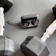 jaybird vista 2 earbuds on yoga mag with dumbbells