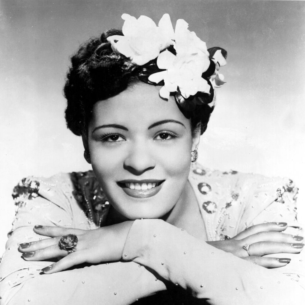 circa 1939: jazz singer billie holiday poses for a portrait in circa 1939 with a flower in her hair. (photo by michael ochs archives/getty images)