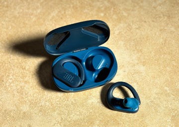 a pair of blue open ear headphones