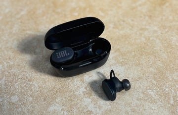 a pair of jbl earbuds in a charging case