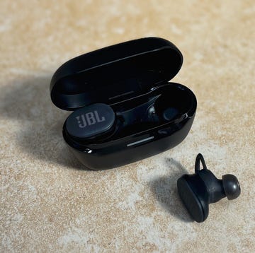 a pair of jbl earbuds in a charging case a pair of jbl earbuds in a charging case