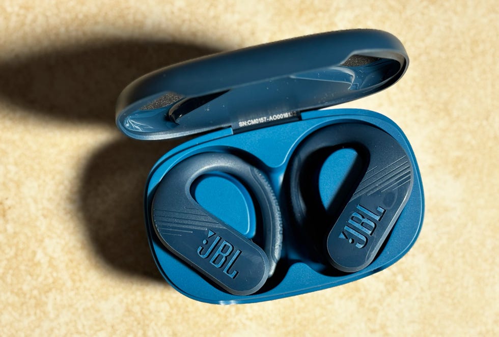 a pair of navy earbuds in a charging case