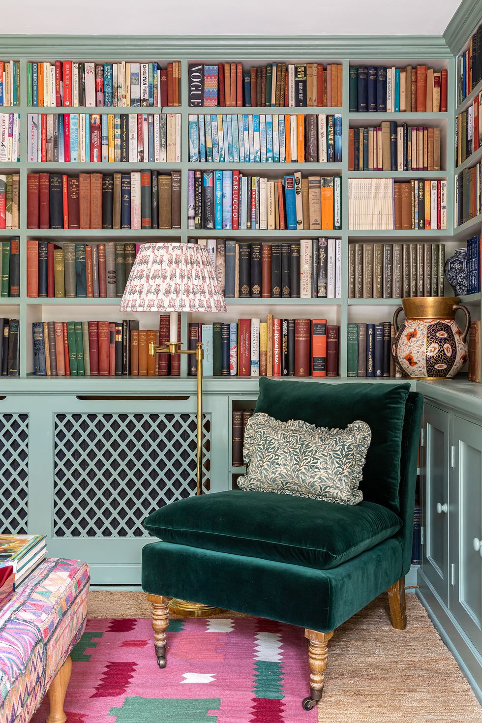 velvet chair and built in bookshelf