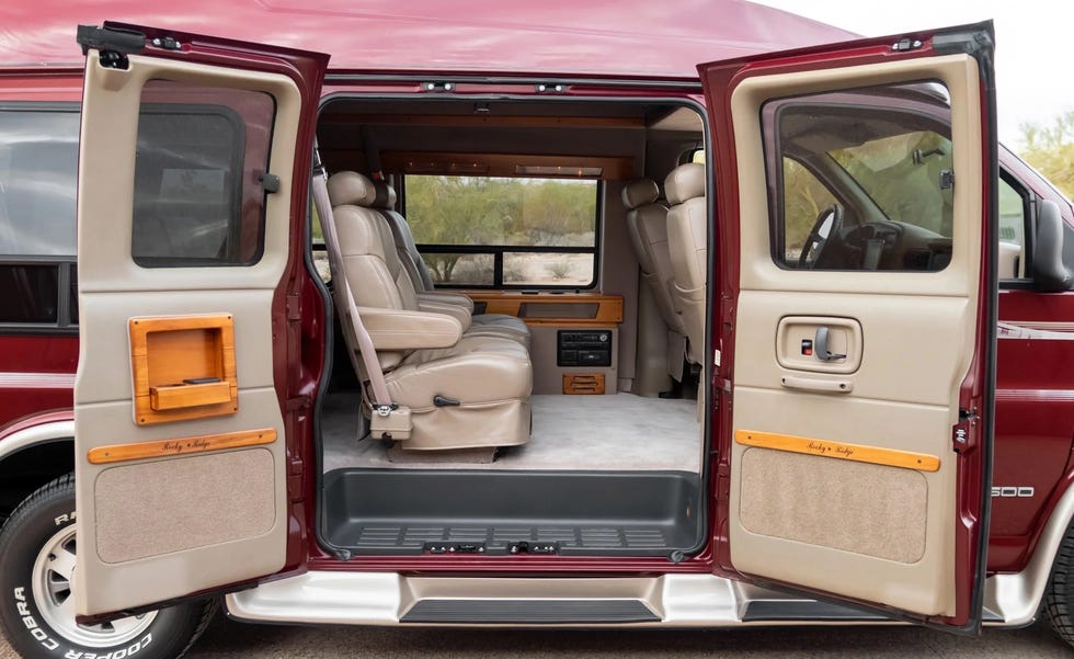 a red chevrolet express conversion van's interior