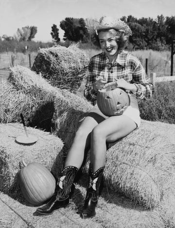 vintage halloween costumes woman dressed as cowgirl