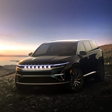 2024 black jeep wagoneer s parked overlooking the ocean at sunrise