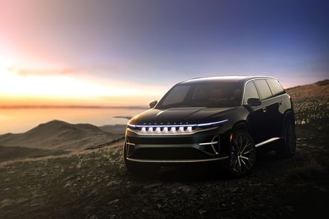 2024 black jeep wagoneer s parked overlooking the ocean at sunrise
