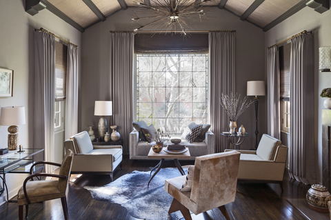 living room with vaulted vaulted ceilings and a gray palette