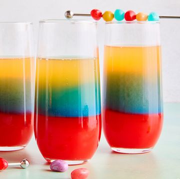 red, blue, and yellow layers in a drink topped with jelly beans