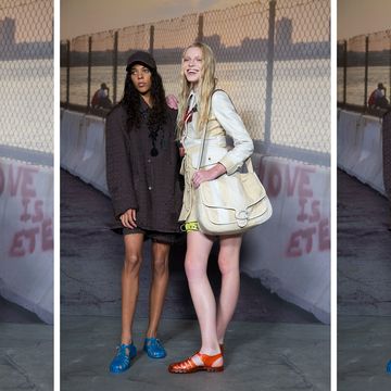 two models from coach spring summer 2023 wear pairs of coach jelly sandals in front of a gate backdrop to illustrate a guide to summer jelly sandals for 2023