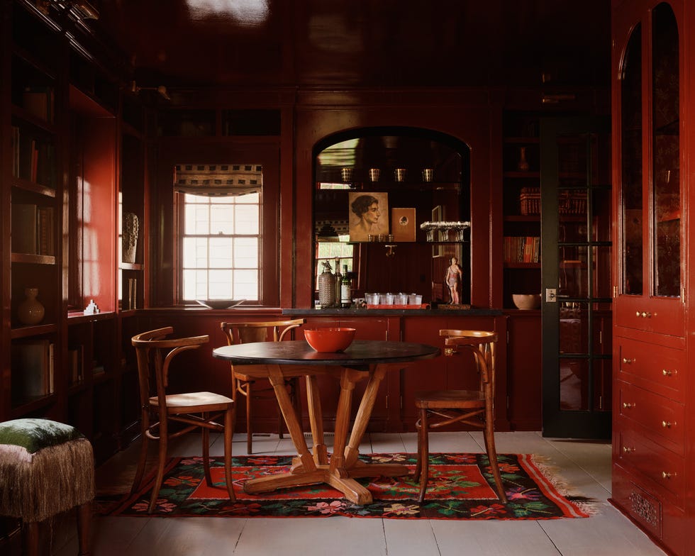 a room with a table and chairs