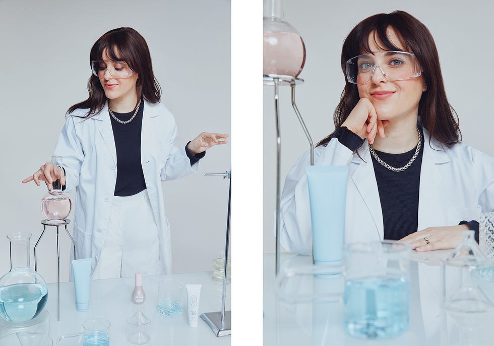 lab setting with a person in a lab coat surrounded by various glassware and cosmetic products