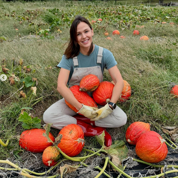 Jennifer Garner person surrounded by pumpkins in a field