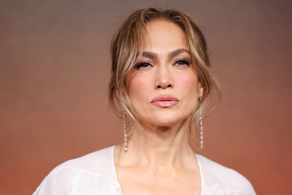 JLo stuns in backless white swimsuit in summer photo drop