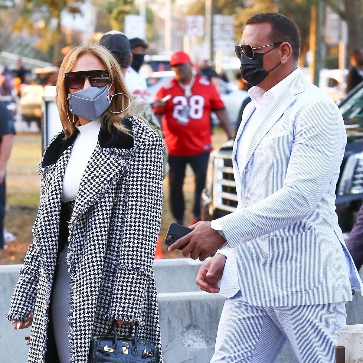 J.Lo Wore Louis Vuitton Crop Top & Houndstooth Coat to Super Bowl