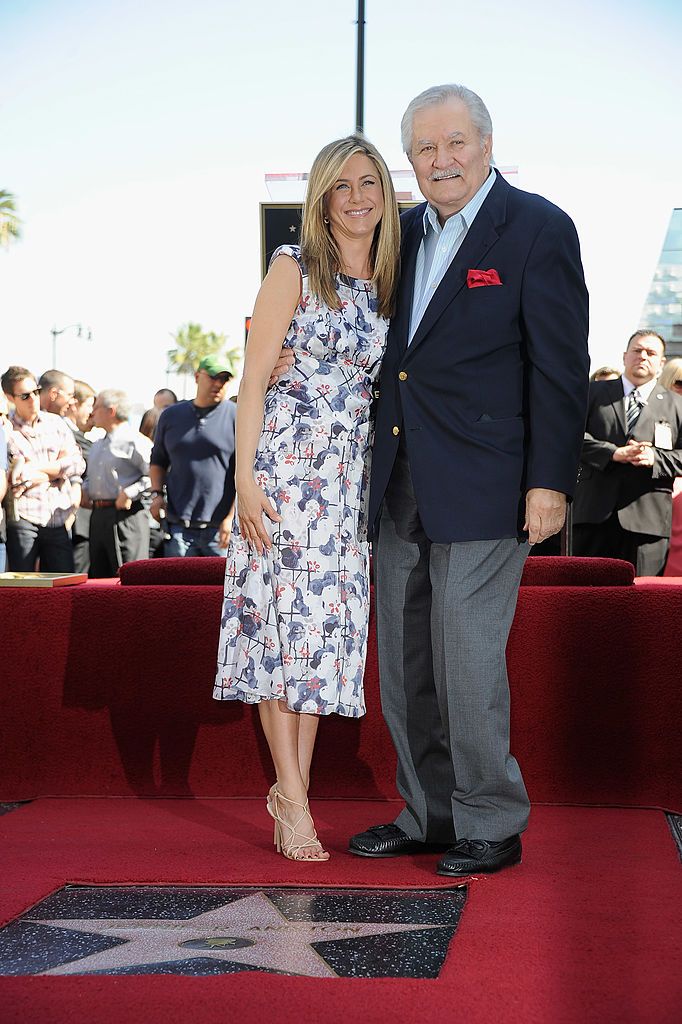 hollywood, ca february 22 actress jennifer aniston poses who was honored with a star the the hollywood walk of fame poses with her father john aniston on february 22, 2012 in hollywood, california photo by frazer harrisongetty images