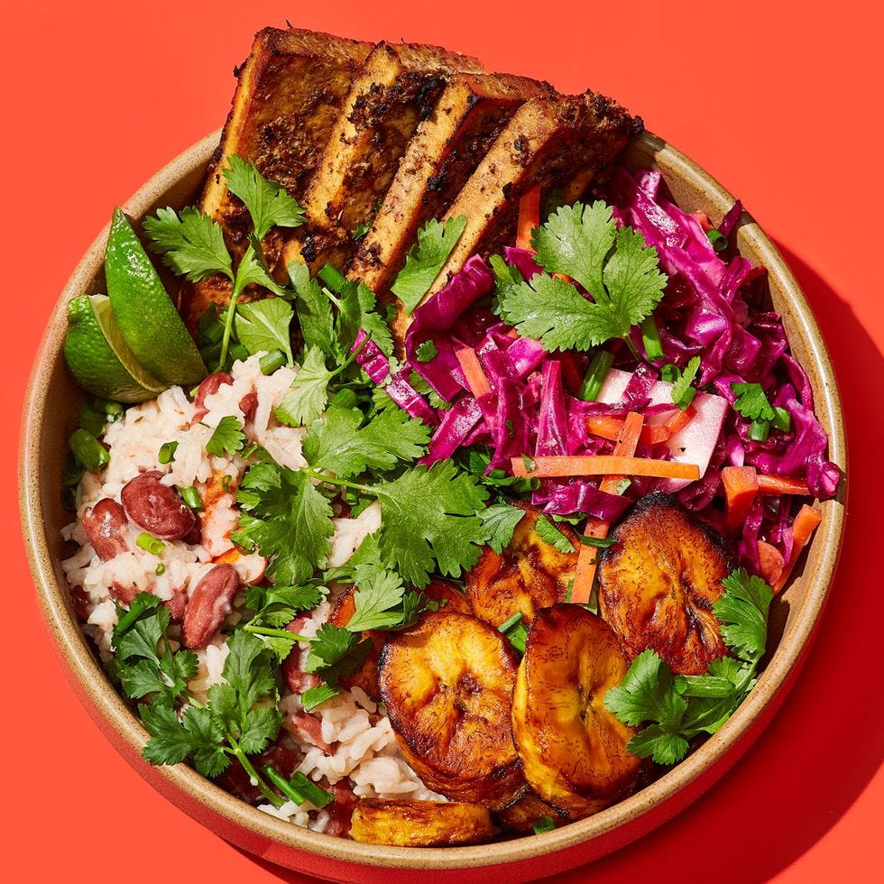jerk tofu rice bowl with kidney beans, plantains, cabbage and carrot slaw, and cilantro