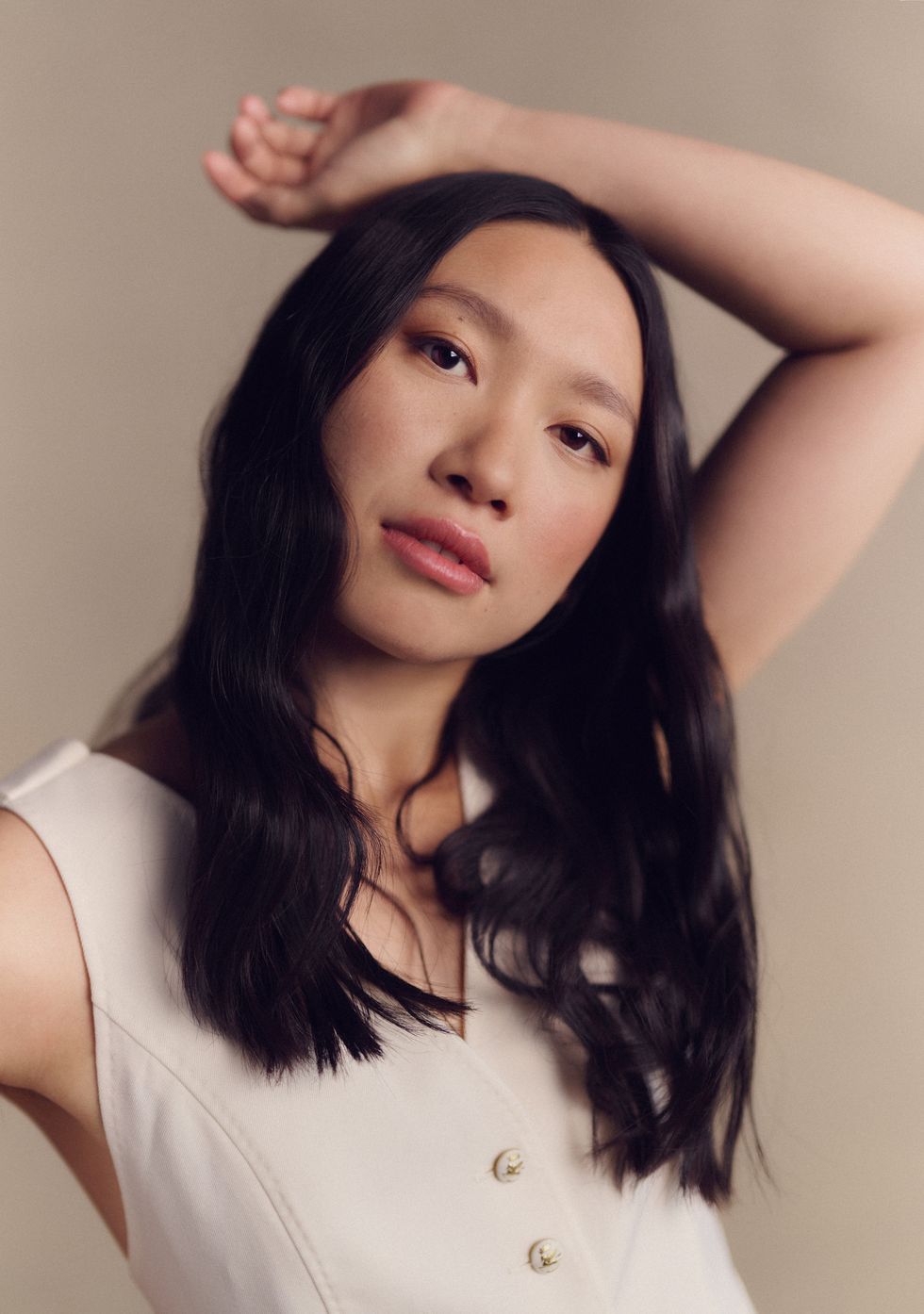 jess hong posing with one arm over her head