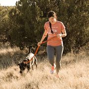 a runner with epilepsy runs with her dog who also has the disease