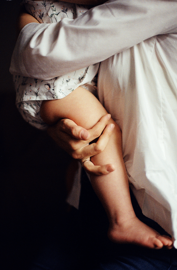 a mother holding a baby