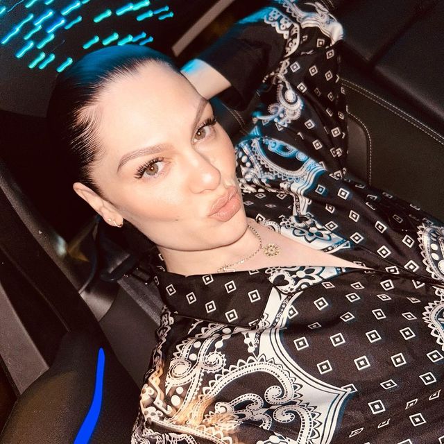 jessie j takes a selfie in the back of a car