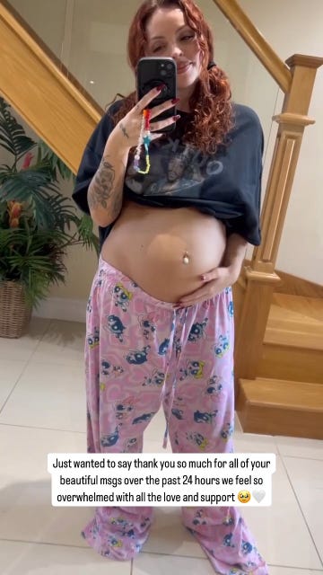 jesy nelson cradles her baby bump in mirror selfie