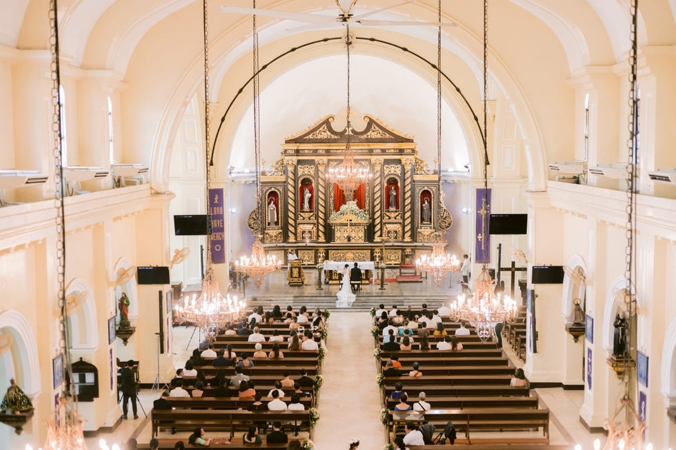 a large church with a large group of people sitting in the front