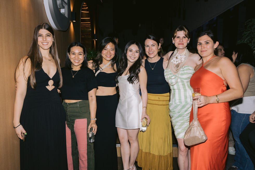 a group of women posing for a photo