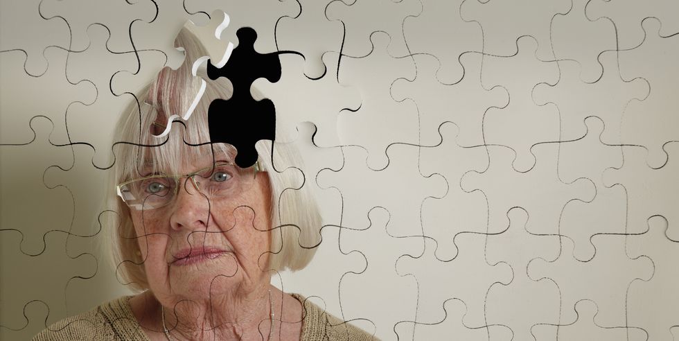 jigsaw puzzle, of a senior woman, falling apart