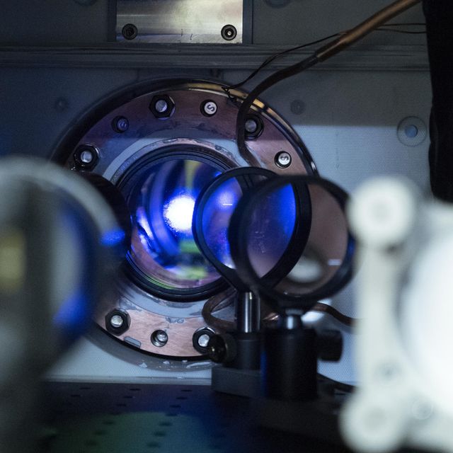 glimpse inside the vacuum chamber of an atomic clock at glowing strontium atoms