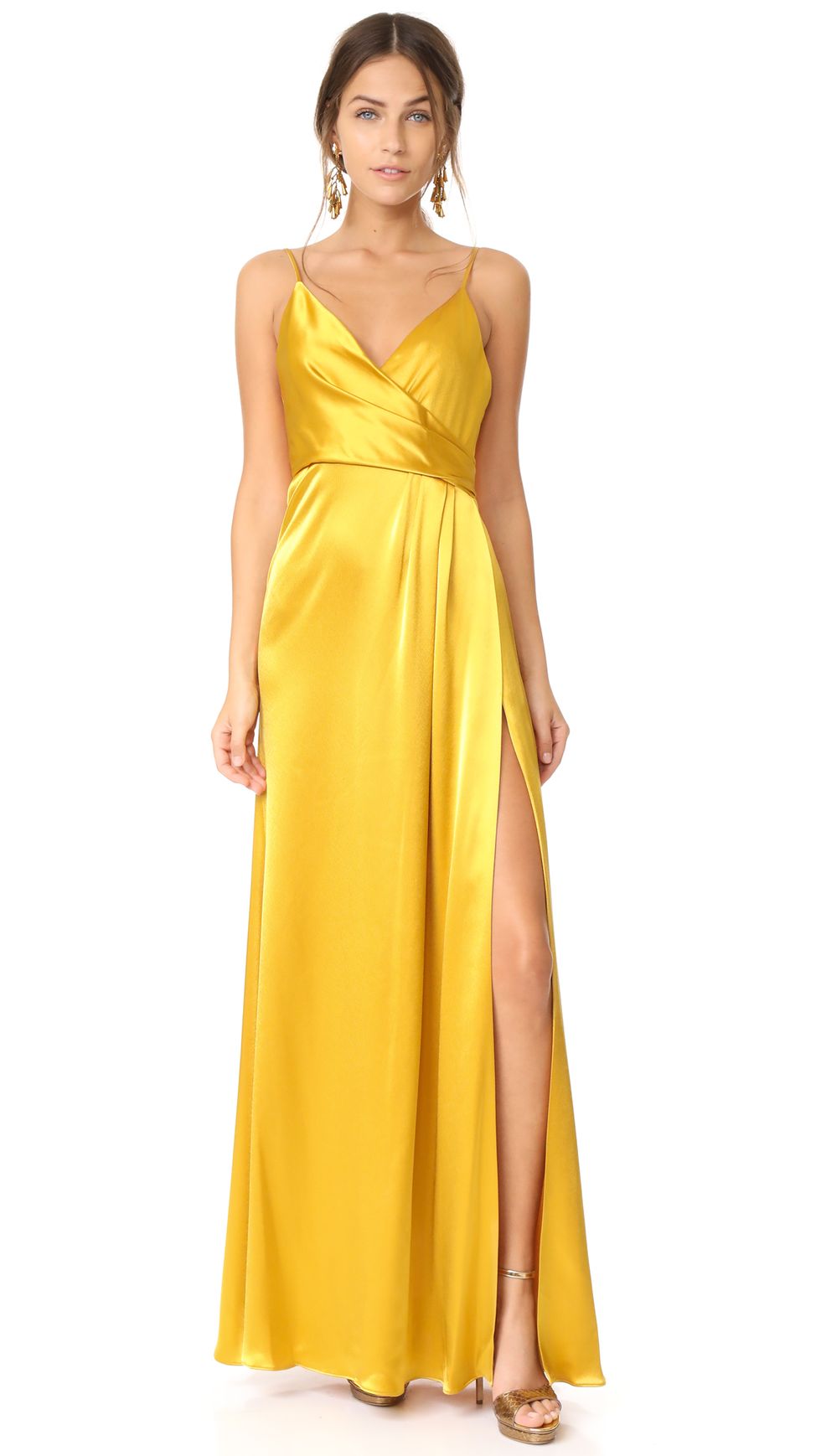 Selena Gomez Teams Chic Yellow Midi Dress with Citrus-Style Handbag