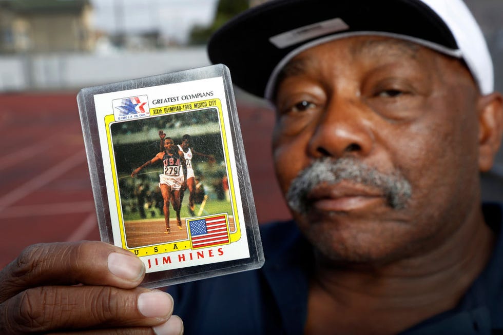 oakland, california aug 18 jim hines, known as the fastest man alive in the1968 olympics after being the first to break the ten second barrier in the 100 meter race, holds up an olympic trading card of his winning race for a portrait at mcclymonds high school in oakland, calif, on thursday, aug 18, 2016 where he graduated in 1964 hines won two gold medals in 1968, one for the 100 meter race for his time of 995 and one with his team in the 4x100 meter relay photo by laura a odamedianews groupeast bay times via getty imagesgroup