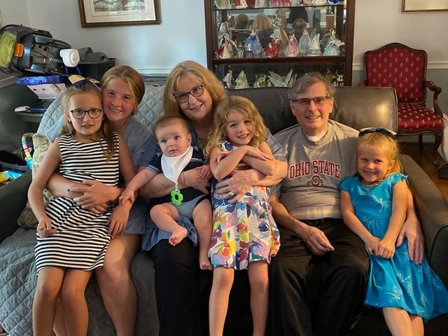 jim leblond sitting on couch with wife and grandchildren