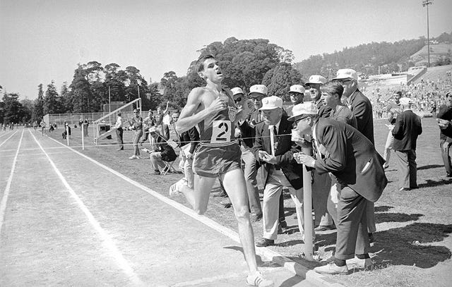 Jim Ryun breaks one-mile world record