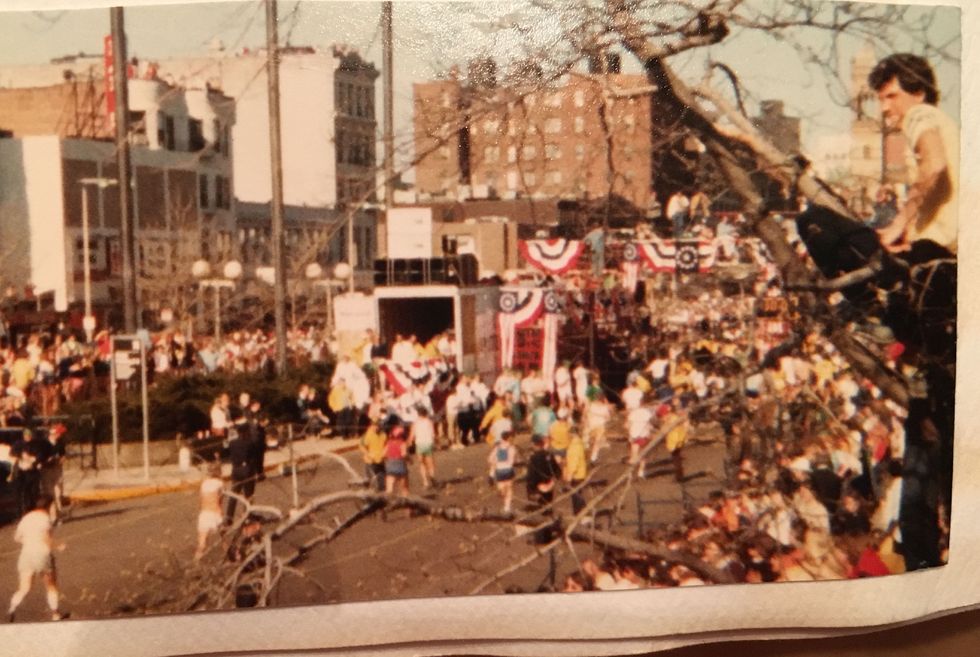 jim in a tree at the boston marathon finish in 1982 