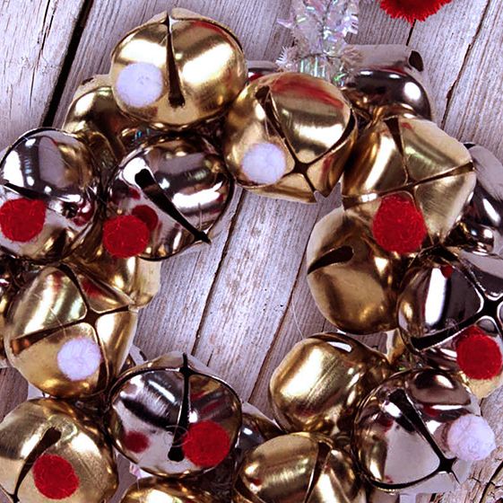 a group of shiny gold and silver ornaments