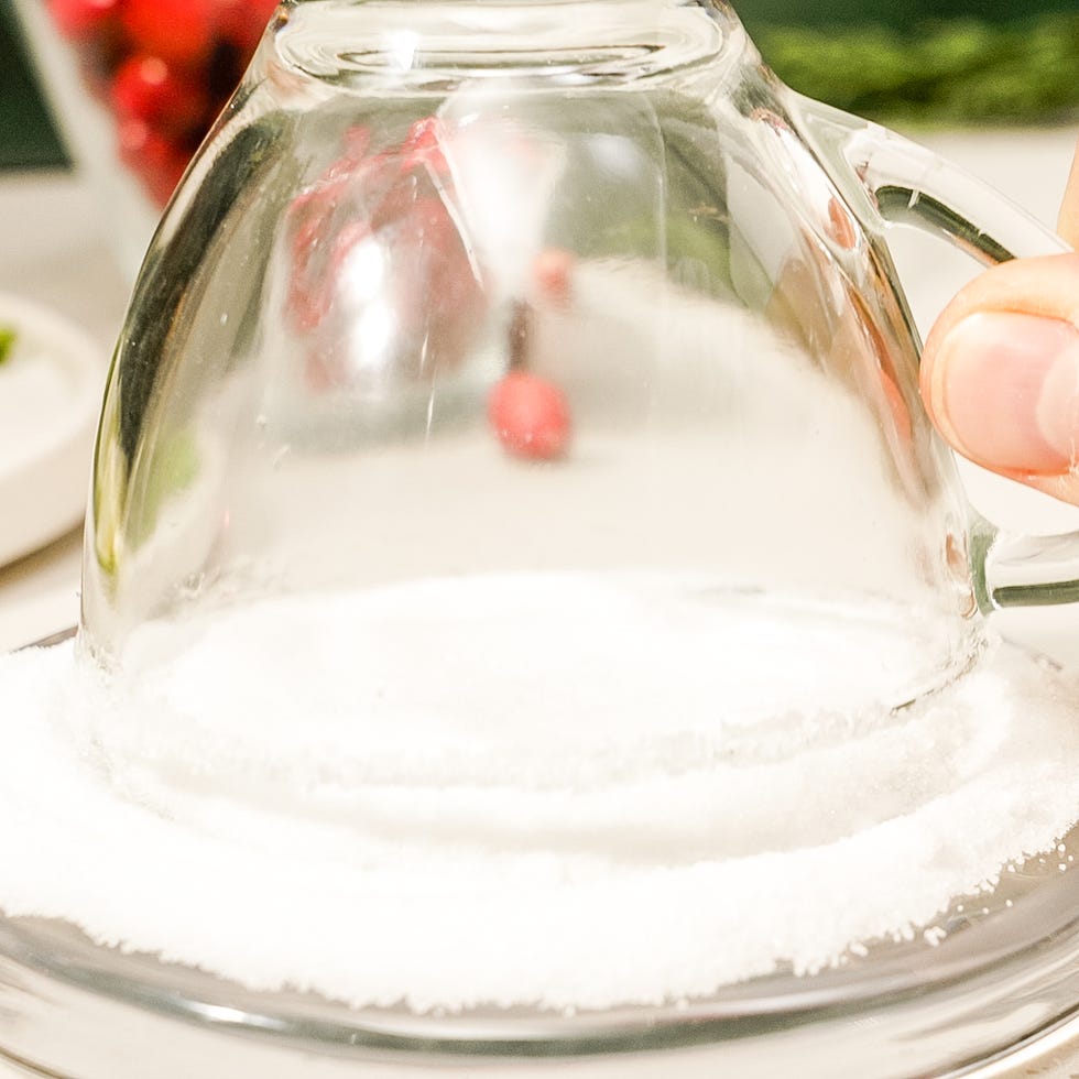 red holiday punch garnished with cranberries and lime